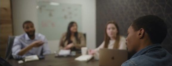 A church staff meeting around a table
